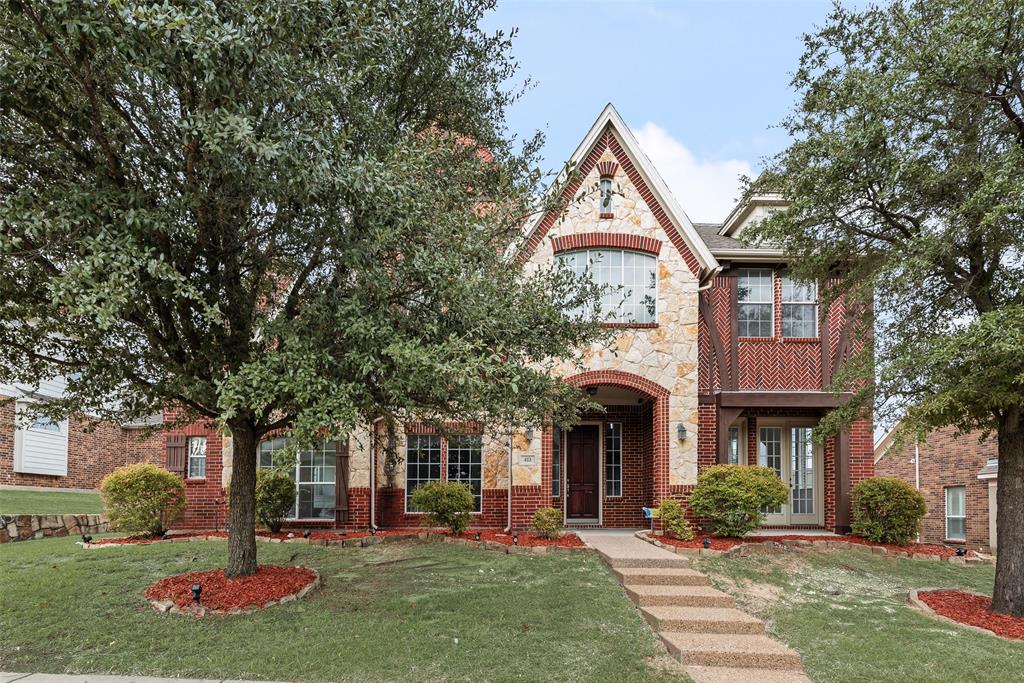 413 Kearsarge Street DeSoto, TX 75115 - Photo 3 of 33 a view of a brick house with a yard and plants