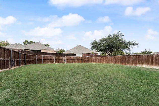 a view of backyard with green space