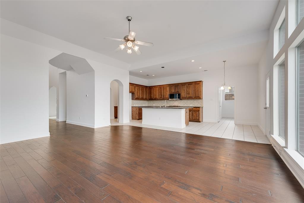 413 Kearsarge Street DeSoto, TX 75115 - Photo 9 of 33 a view of a kitchen with a dishwasher cabinets and wooden floor