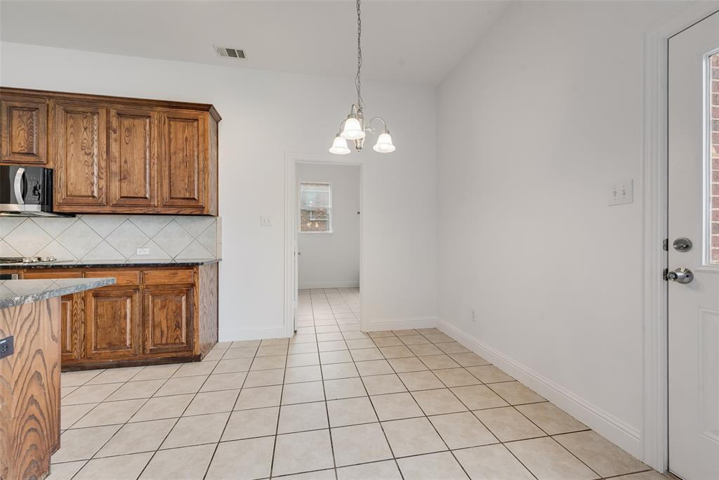 413 Kearsarge Street DeSoto, TX 75115 - Photo 10 of 33 a view of a kitchen with a sink and cabinets