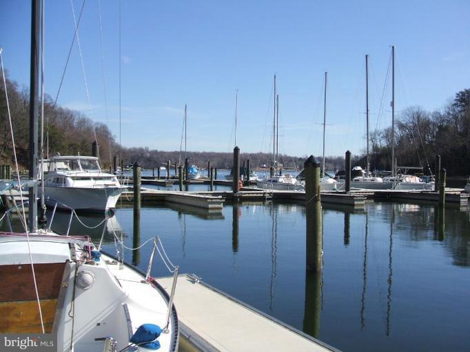 100 A Edgehill Road Annapolis, MD 21405 - Photo 14 of 30 a view of a lake with boats next to a bridge