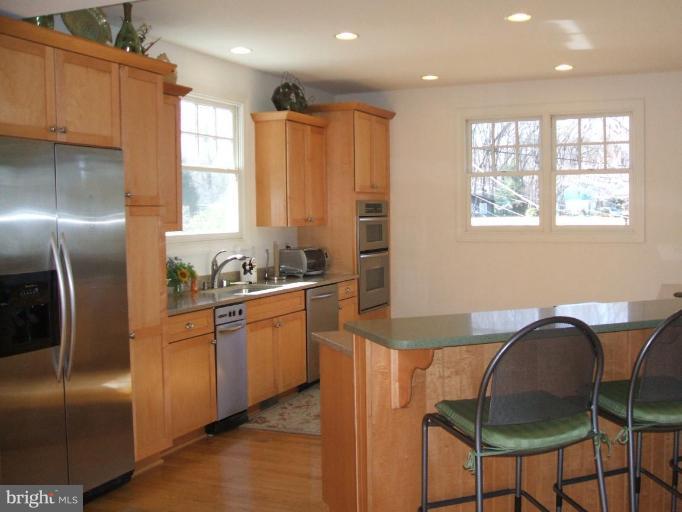 100 A Edgehill Road Annapolis, MD 21405 - Photo 3 of 30 a kitchen with stainless steel appliances granite countertop a refrigerator and a stove top oven