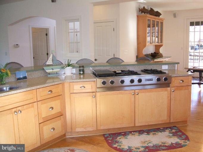 100 A Edgehill Road Annapolis, MD 21405 - Photo 4 of 30 a kitchen with stainless steel appliances granite countertop a stove and a sink