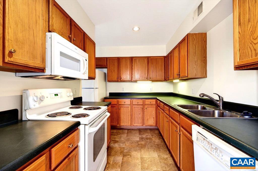 2084 Stone Ridge Wintergreen, VA 22967 - Photo 9 of 41 a kitchen with stainless steel appliances a sink stove and cabinets