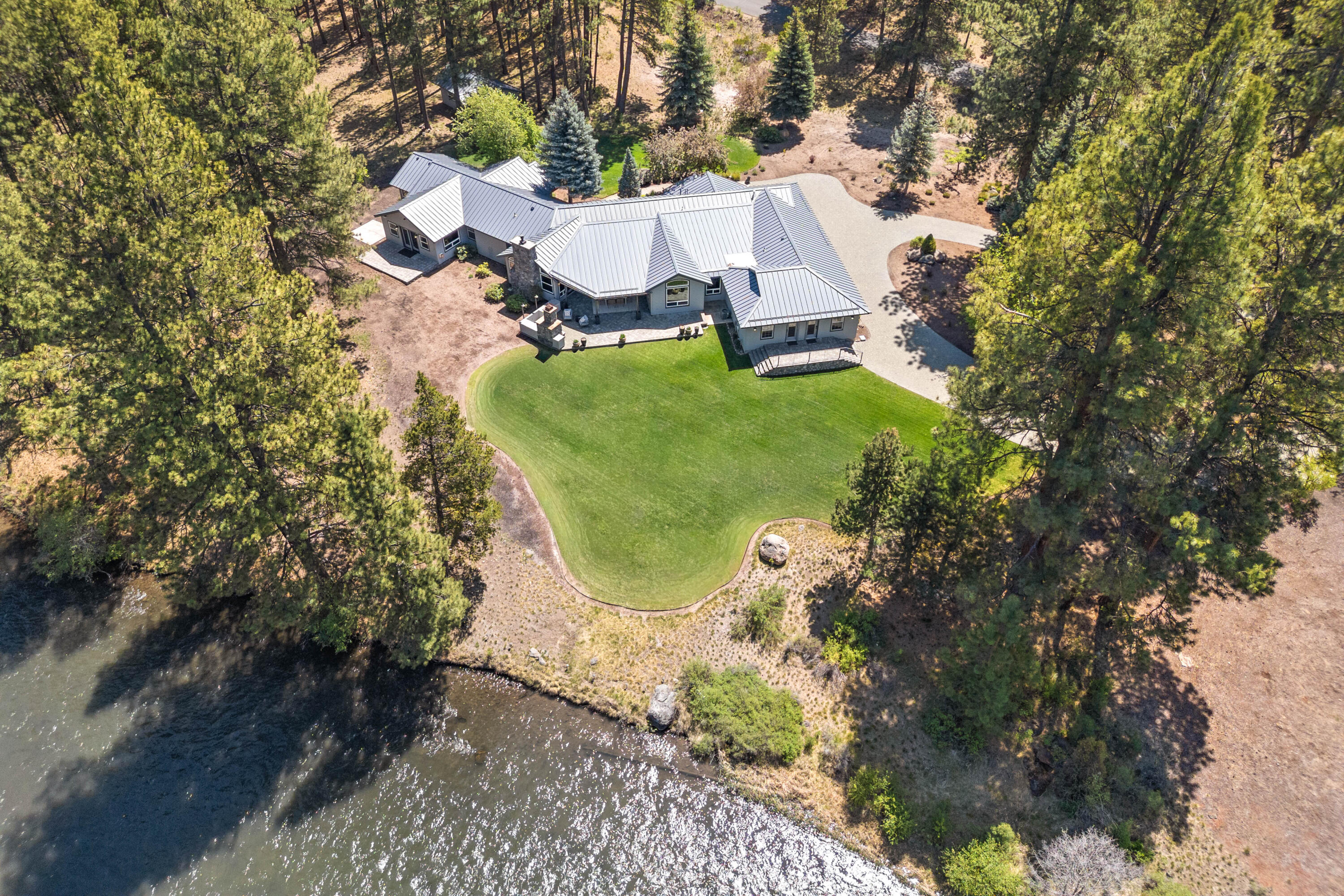 18880 Baker Road Bend, OR 97702 - Photo 16 of 70 an aerial view of a house with garden space and street view