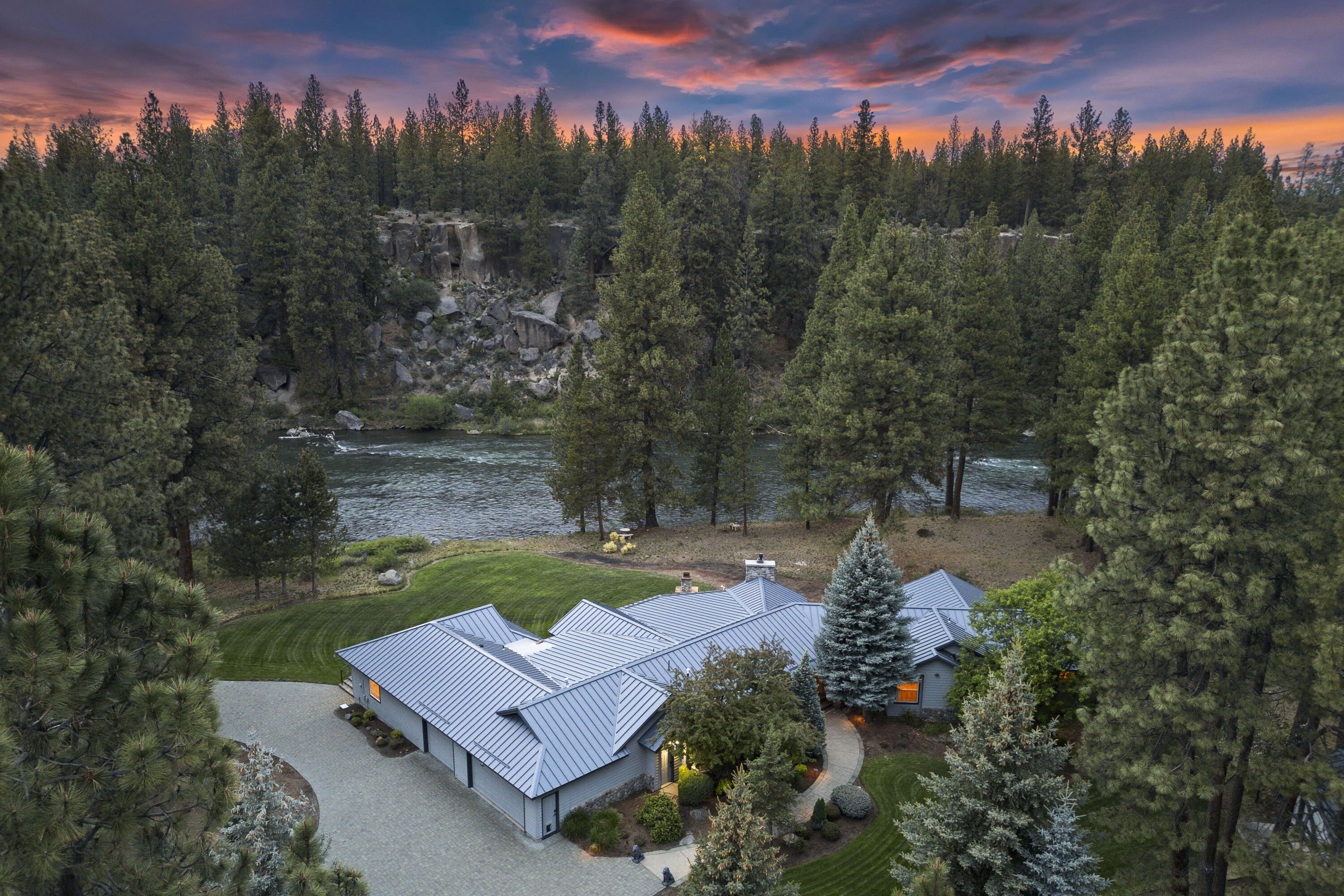 18880 Baker Road Bend, OR 97702 - Photo 3 of 70 a view of a garden with a lake