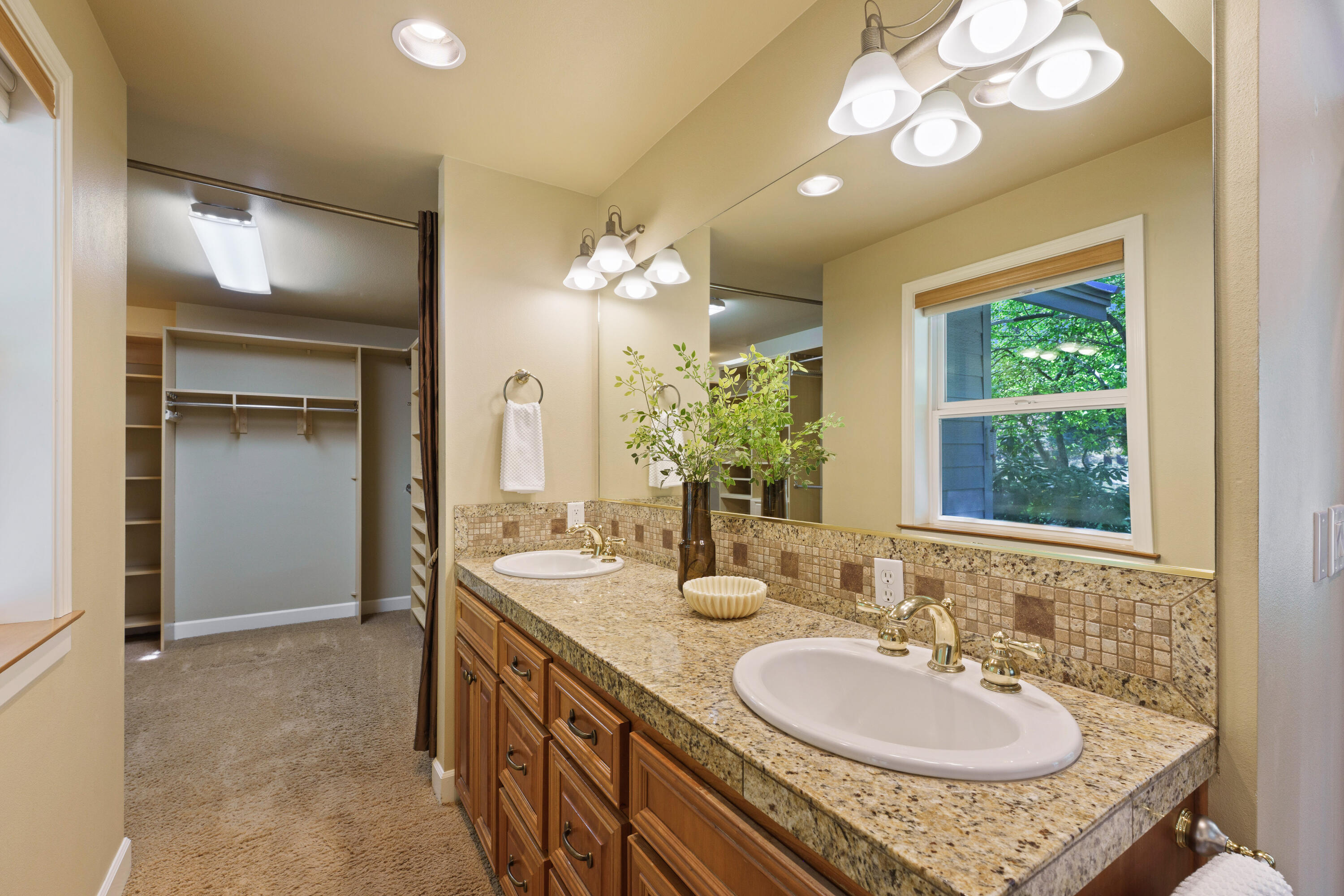 18880 Baker Road Bend, OR 97702 - Photo 42 of 70 a bathroom with a sink double vanity and a mirror