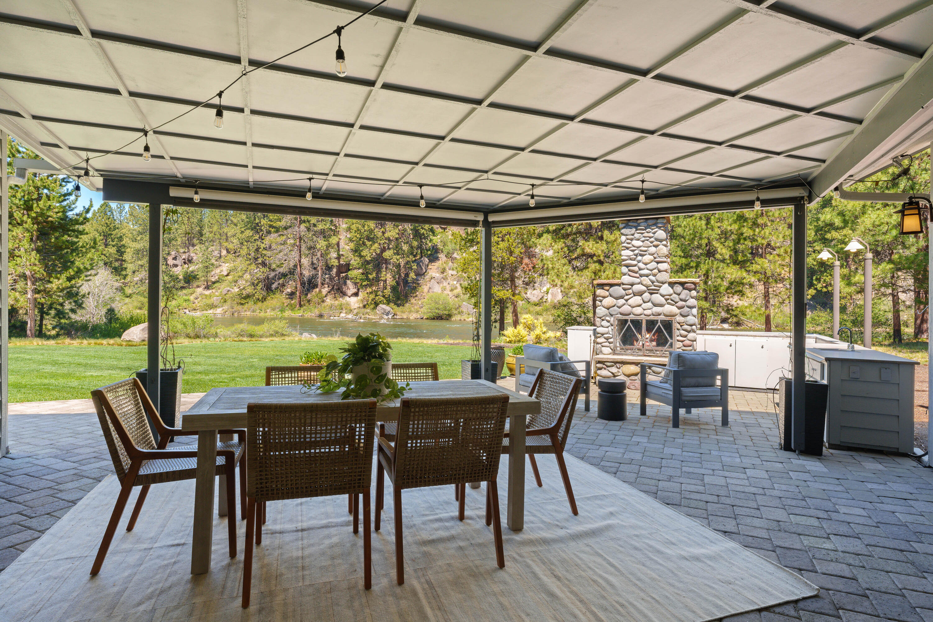 18880 Baker Road Bend, OR 97702 - Photo 53 of 70 a view of a dining room with furniture large windows and wooden floor