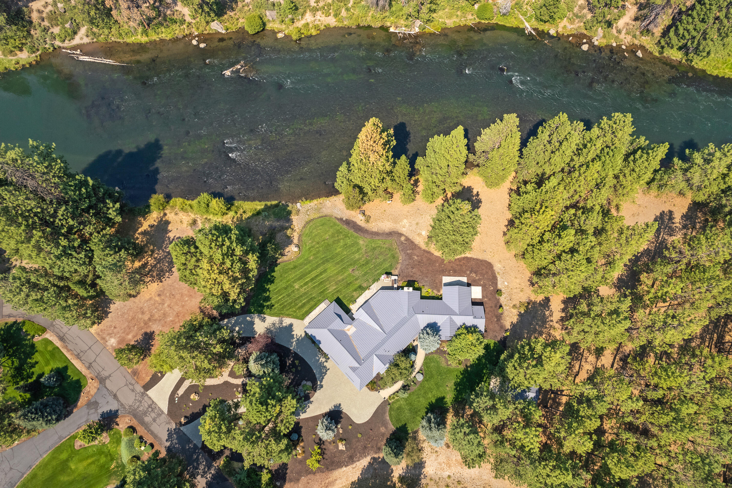 18880 Baker Road Bend, OR 97702 - Photo 6 of 70 an aerial view of a house with a lake view