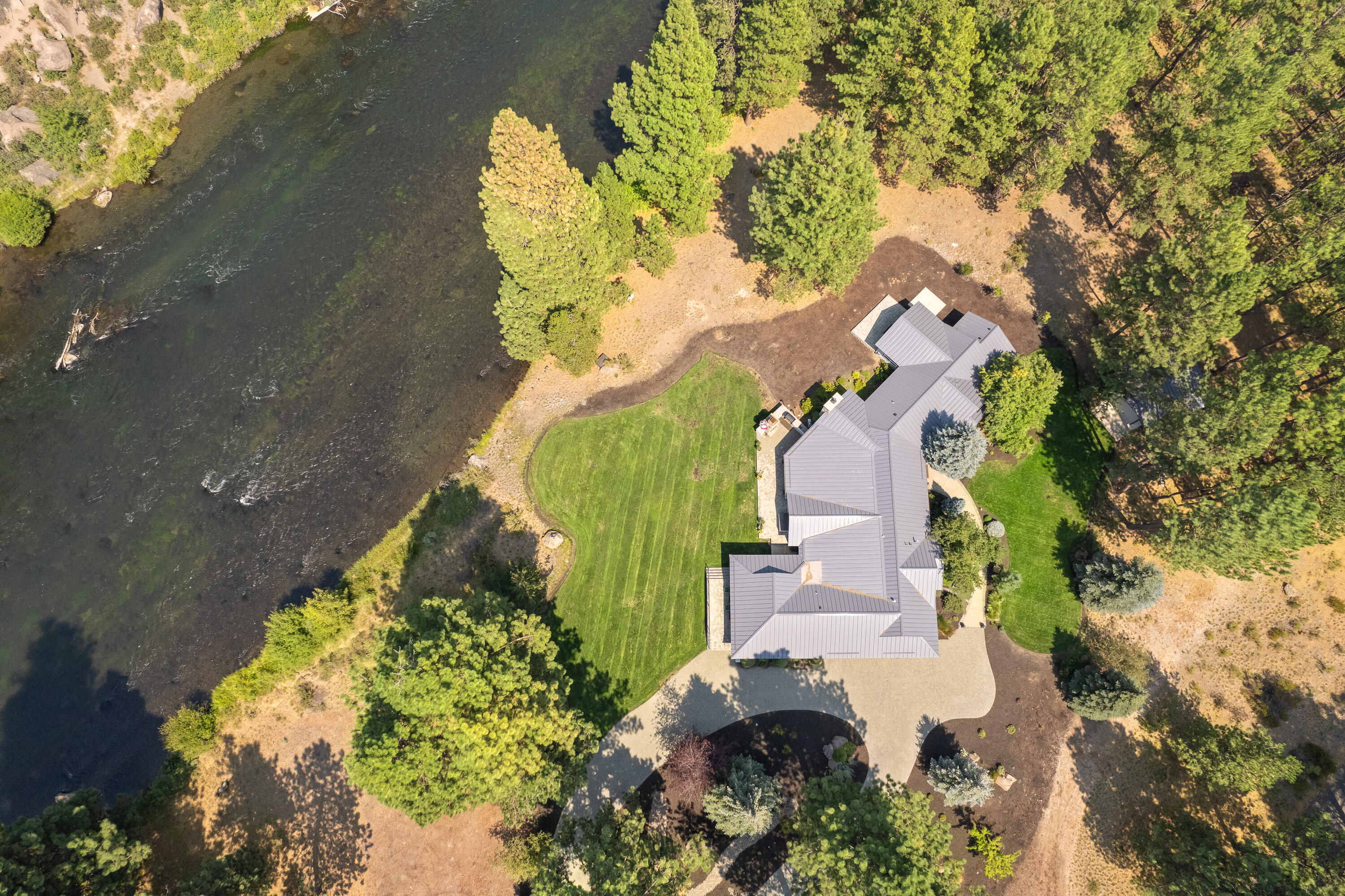 18880 Baker Road Bend, OR 97702 - Photo 7 of 70 an aerial view of a house with a yard and garden