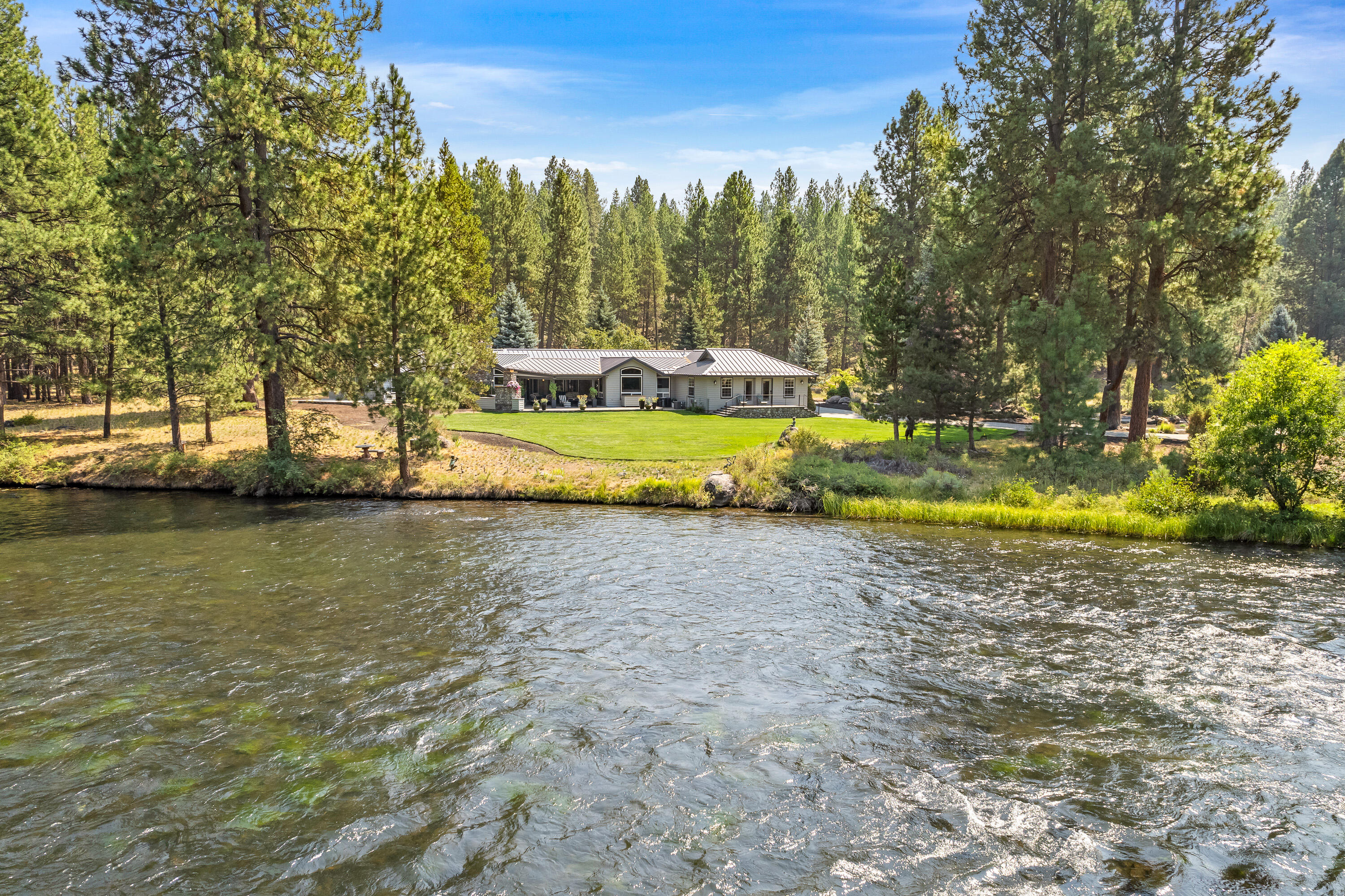18880 Baker Road Bend, OR 97702 - Photo 9 of 70 a view of a swimming pool with an outdoor space