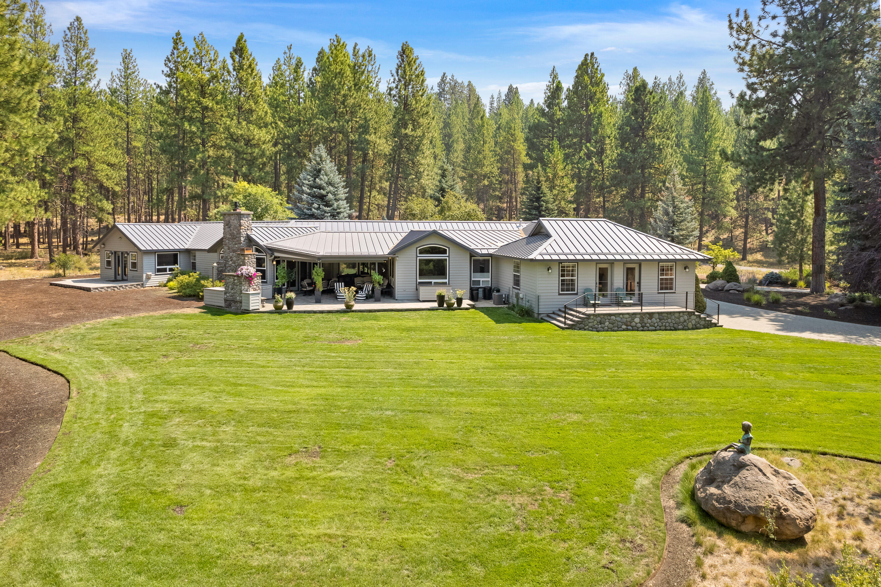 18880 Baker Road Bend, OR 97702 - Photo 10 of 70 a view of a swimming pool with an outdoor space and seating area