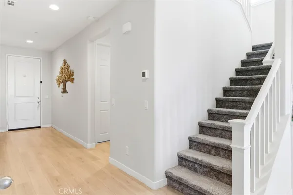 a view of entryway with wooden floor