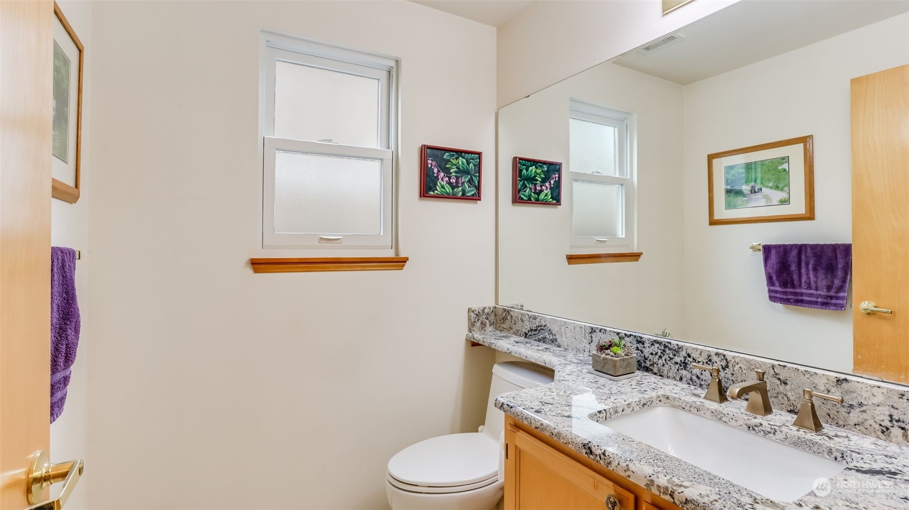27728 211th Court Southeast Maple Valley, WA 98038 - Photo 11 of 23 a bathroom with a granite countertop toilet sink and mirror
