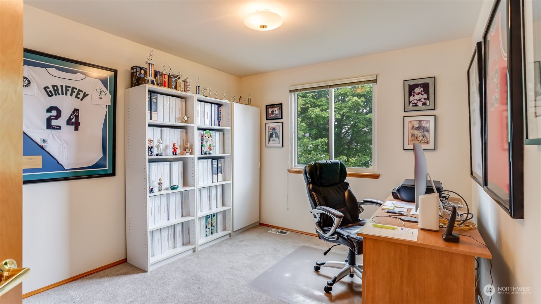 27728 211th Court Southeast Maple Valley, WA 98038 - Photo 14 of 23 a view of a workspace with furniture and a bookshelf