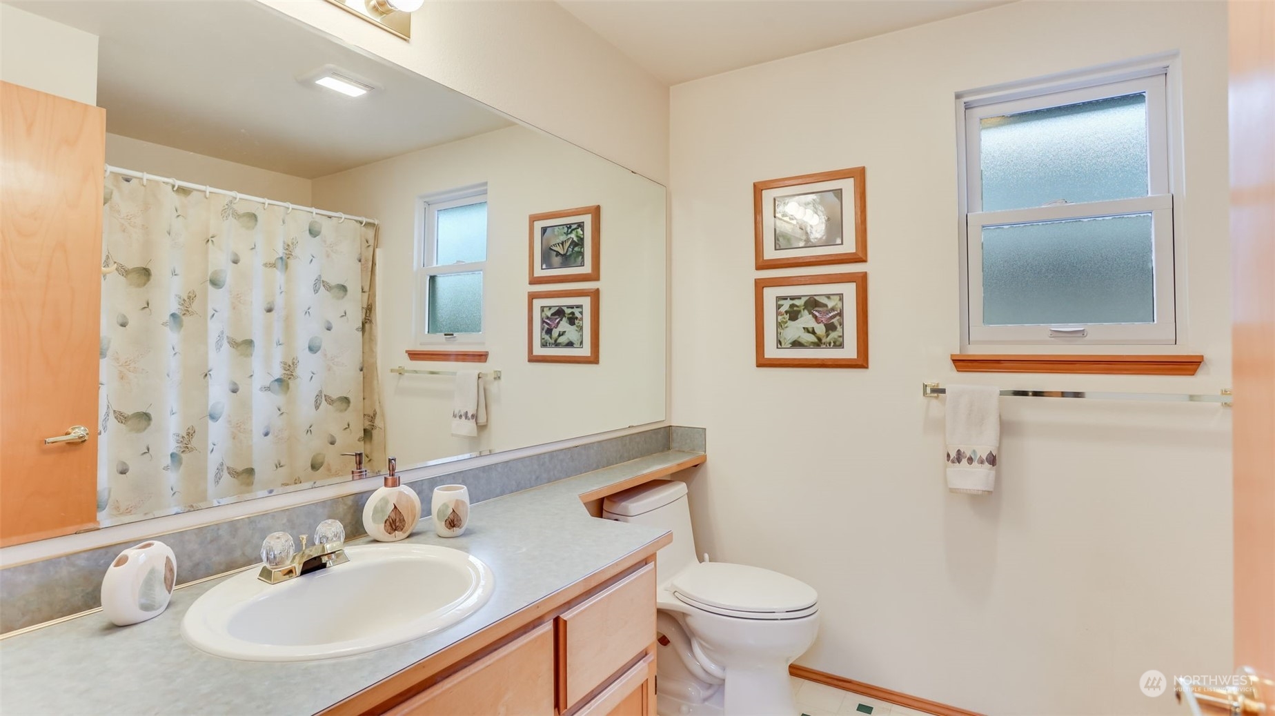 27728 211th Court Southeast Maple Valley, WA 98038 - Photo 15 of 23 a bathroom with a sink toilet and vanity