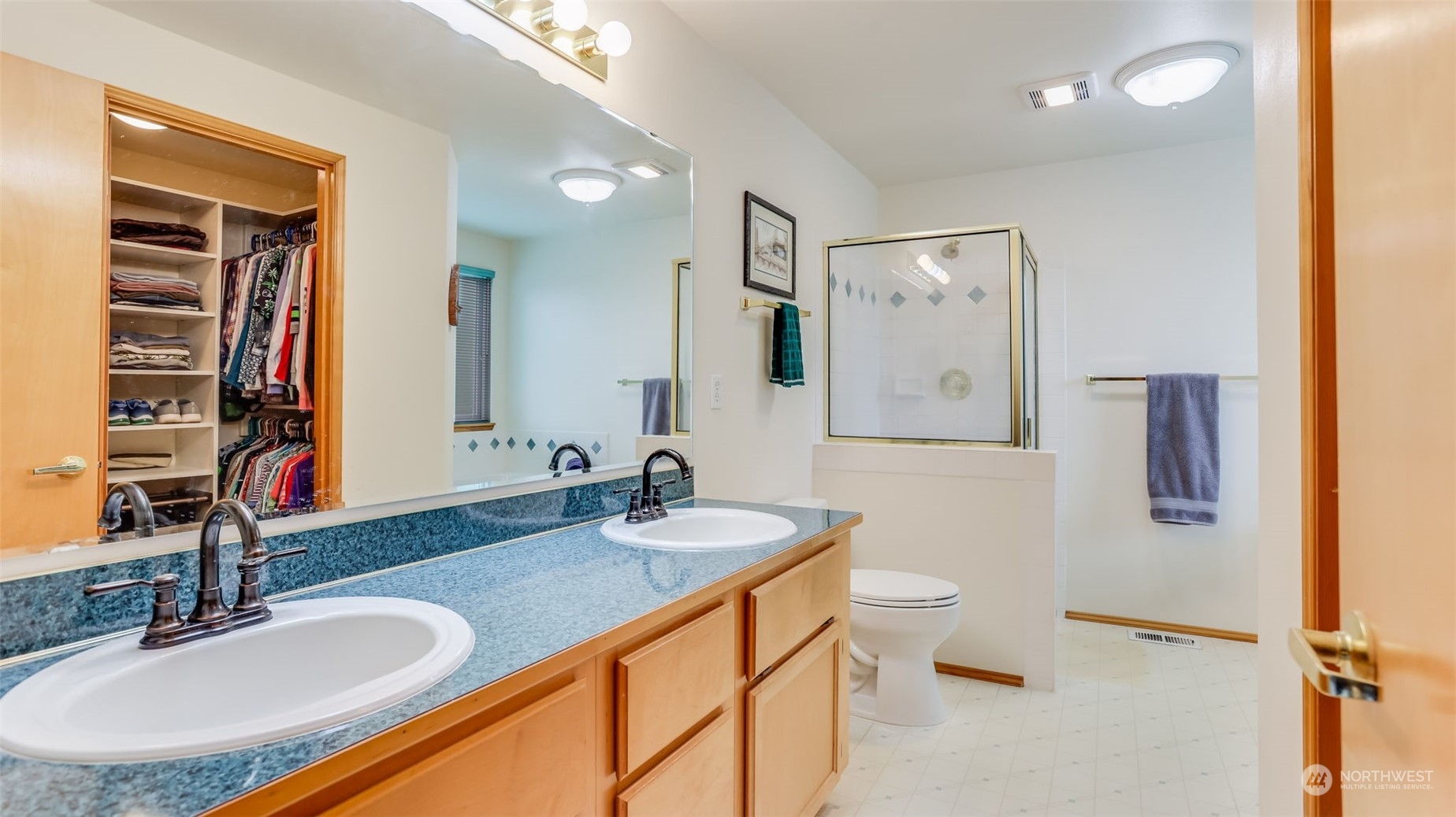 27728 211th Court Southeast Maple Valley, WA 98038 - Photo 18 of 23 a bathroom with a sink double vanity and a toilet