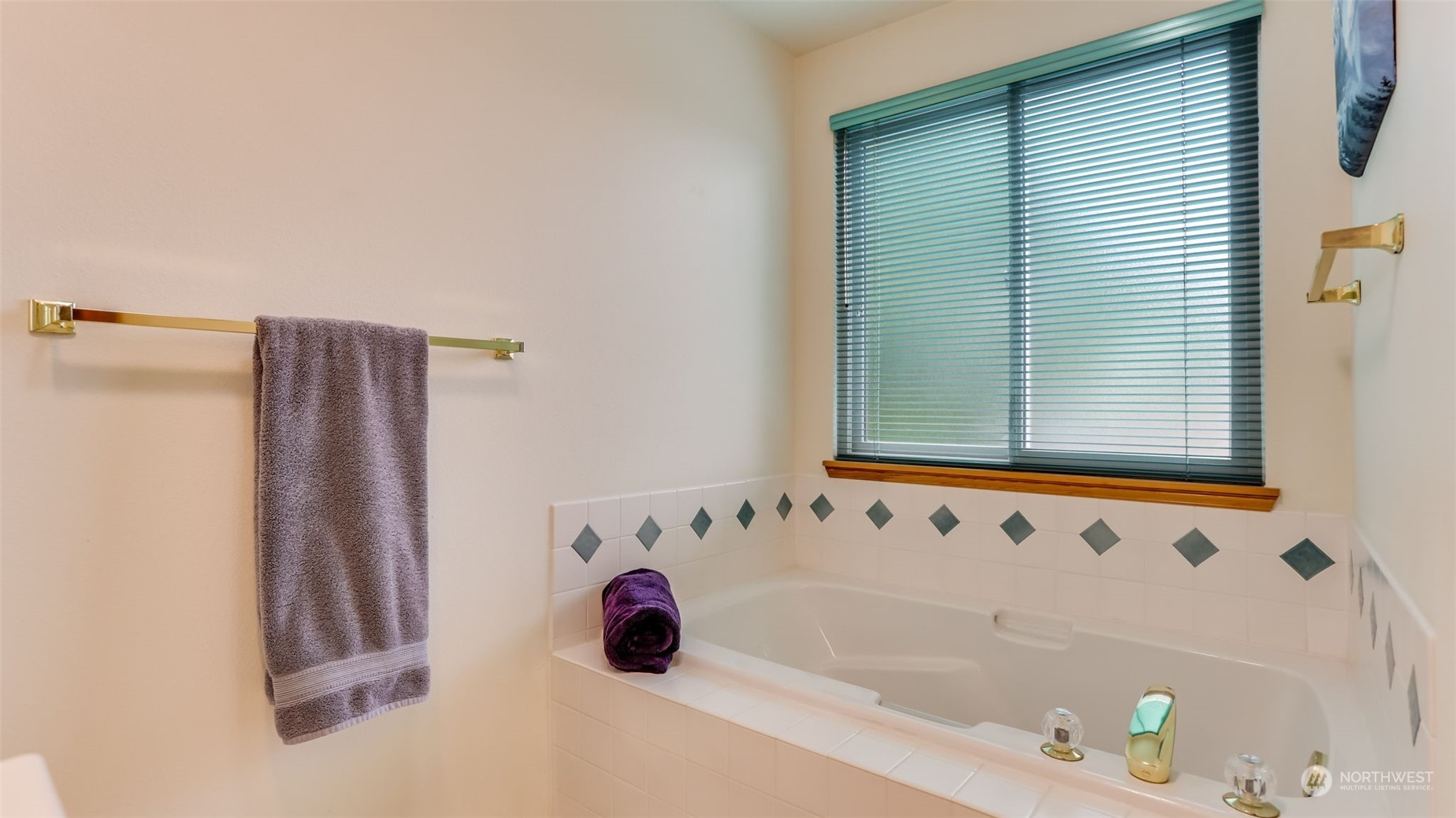 27728 211th Court Southeast Maple Valley, WA 98038 - Photo 19 of 23 a bathroom with a bathtub and a shower