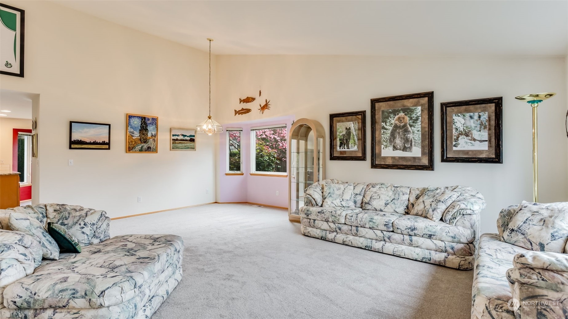 27728 211th Court Southeast Maple Valley, WA 98038 - Photo 3 of 23 a living room with furniture and painting on the wall