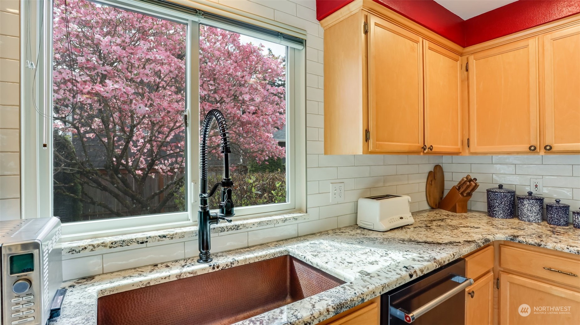 27728 211th Court Southeast Maple Valley, WA 98038 - Photo 7 of 23 a kitchen with a sink and a window