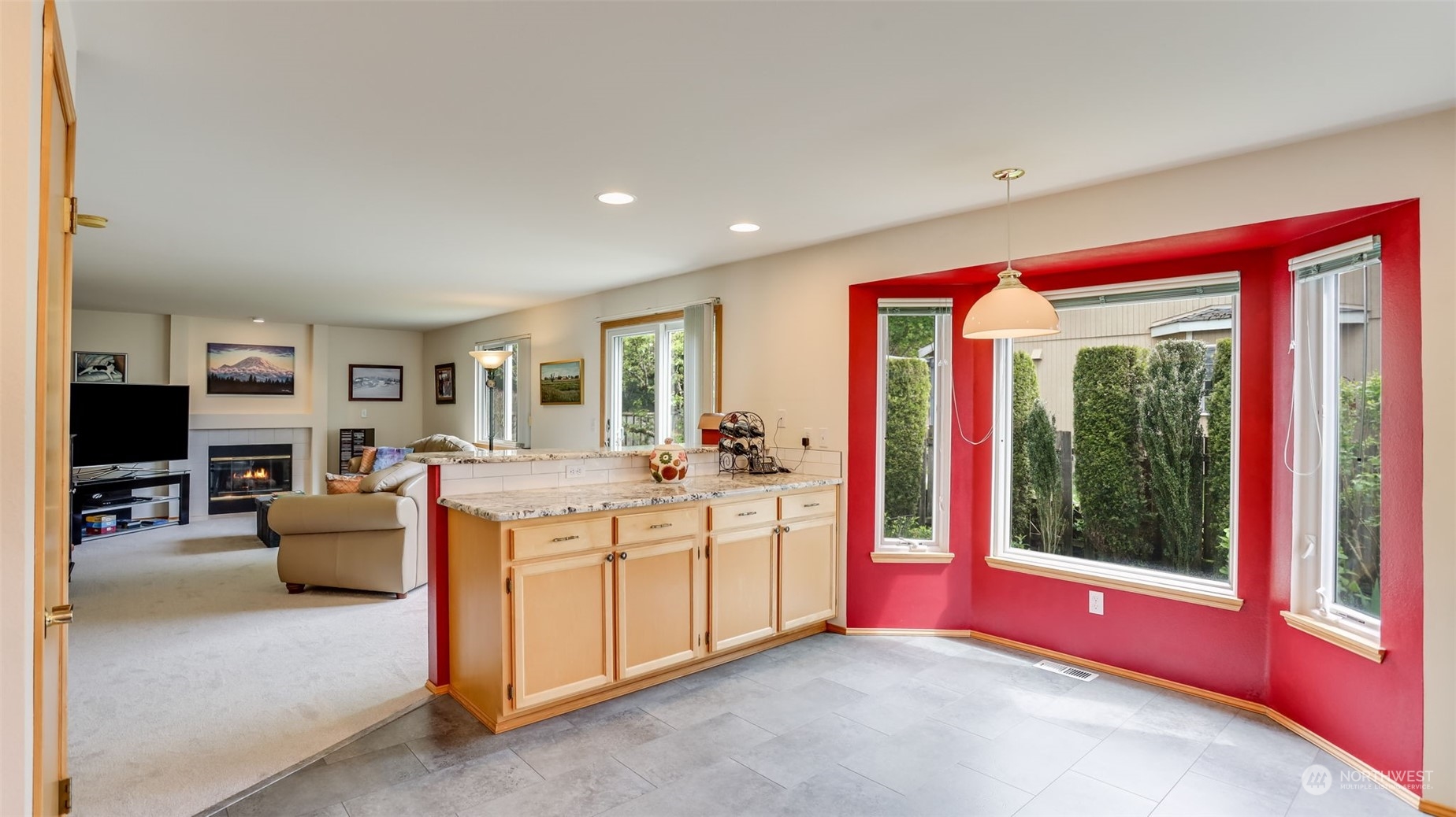 27728 211th Court Southeast Maple Valley, WA 98038 - Photo 8 of 23 a living room with furniture and a floor to ceiling window