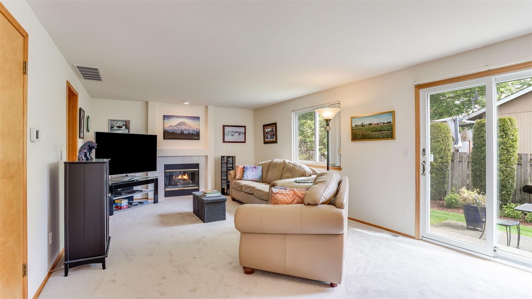 27728 211th Court Southeast Maple Valley, WA 98038 - Photo 9 of 23 a living room with furniture and a flat screen tv