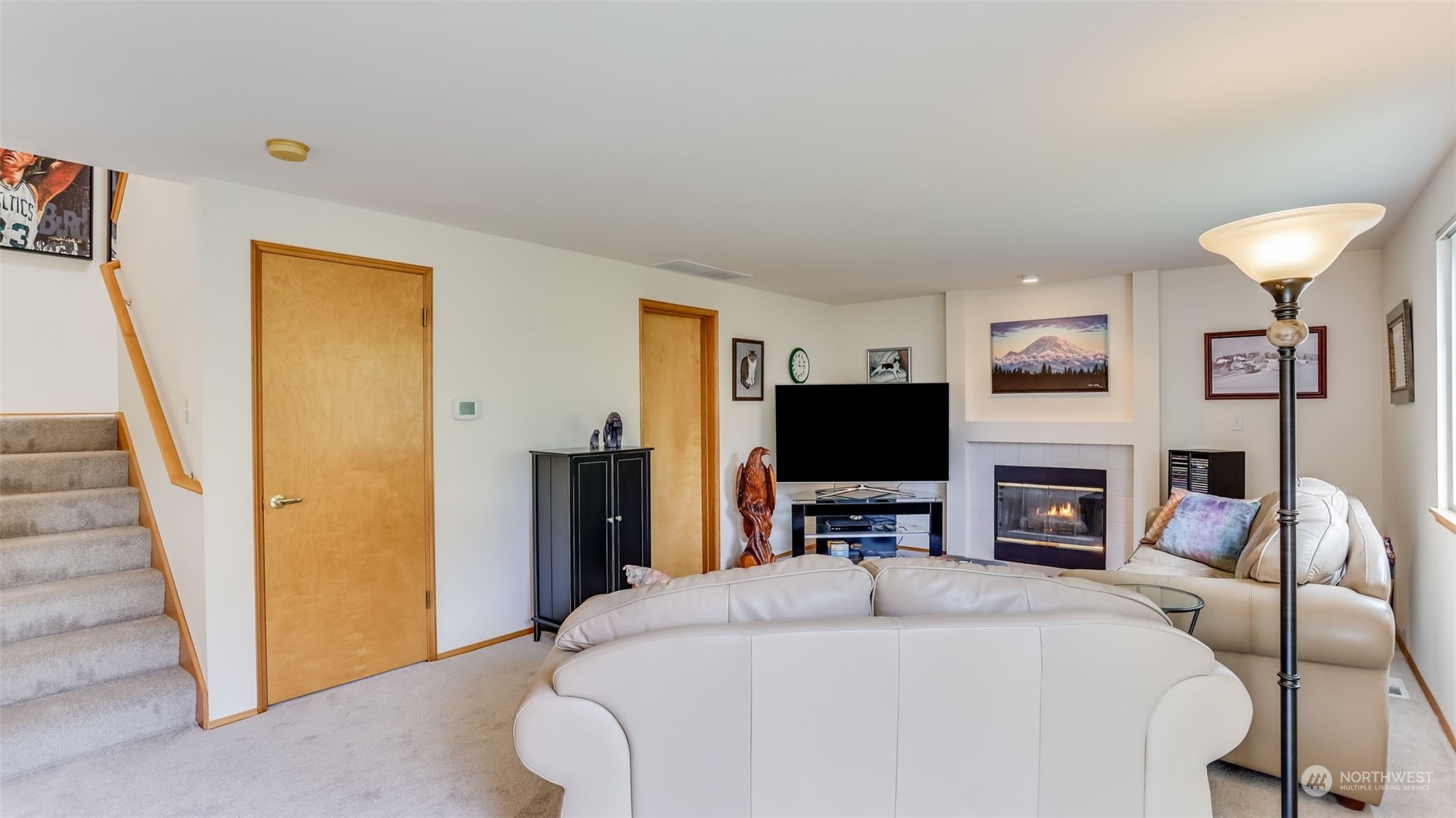 27728 211th Court Southeast Maple Valley, WA 98038 - Photo 10 of 23 a bedroom with a bed and a flat screen tv