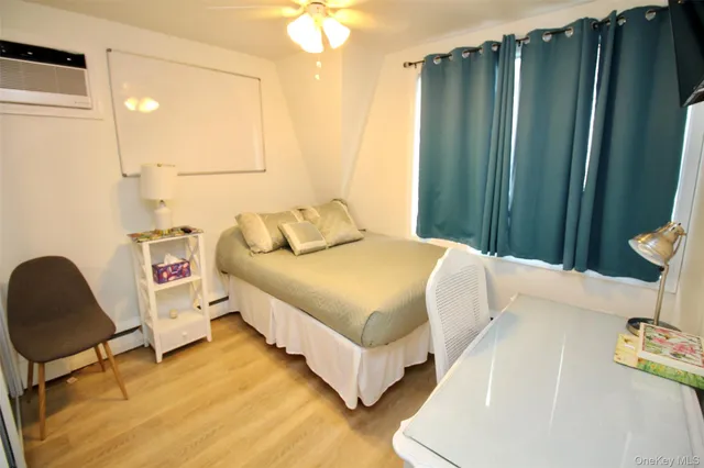 a bedroom with a bed and a chair