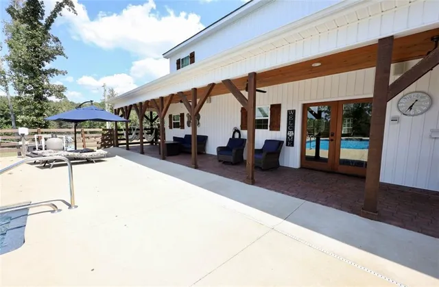 a view of a swimming pool with a patio