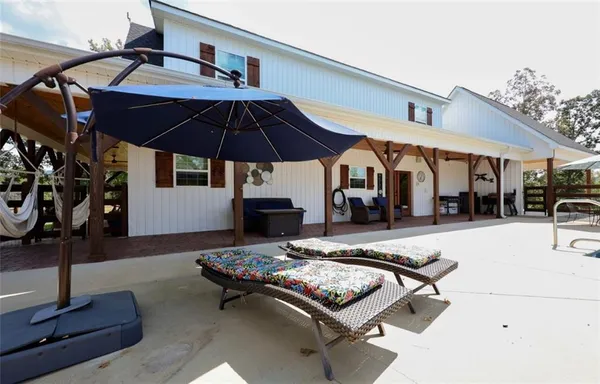 a outdoor space with furniture and umbrella