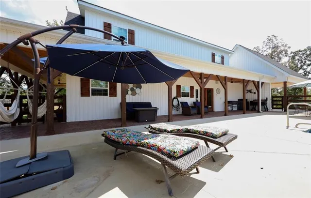 a outdoor space with furniture and umbrella