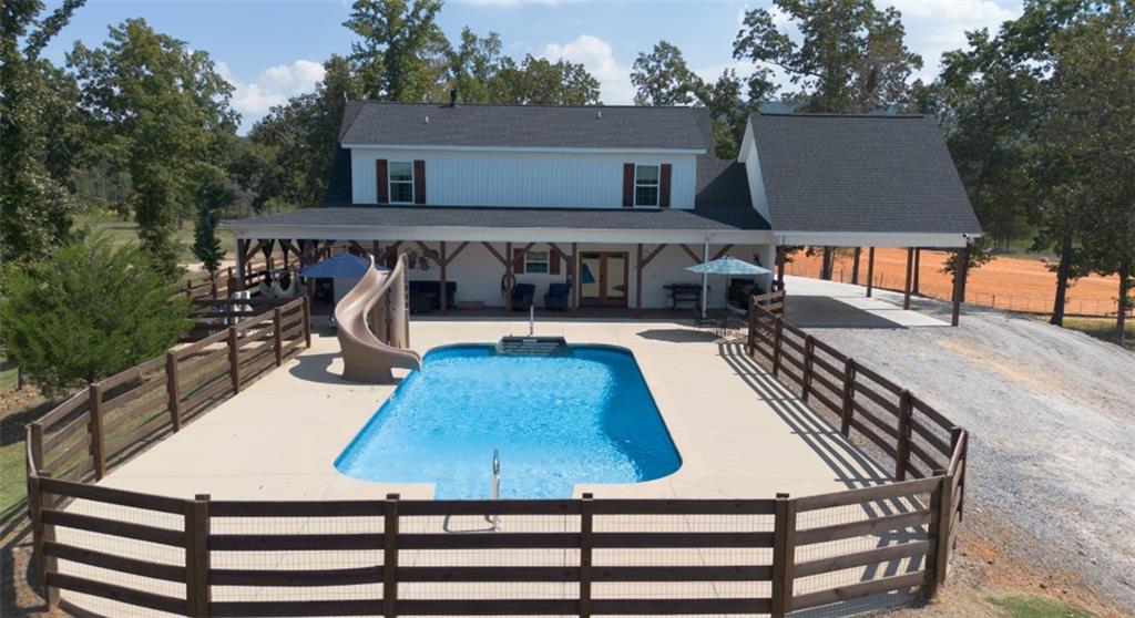 286 County Road 28 Centre, AL 35960 - Photo 29 of 50 a view of a roof deck with table and chairs with wooden floor and fence