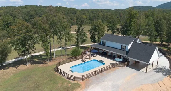 a backyard of a house with outdoor seating