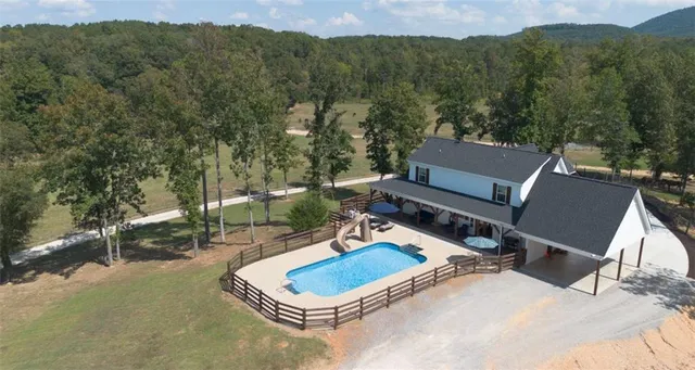 a backyard of a house with outdoor seating
