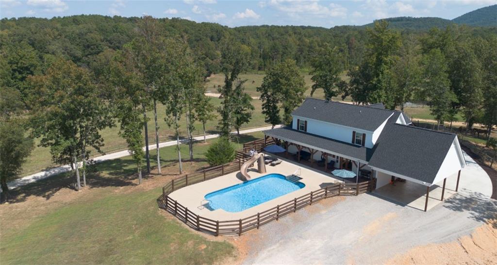286 County Road 28 Centre, AL 35960 - Photo 31 of 50 a backyard of a house with outdoor seating