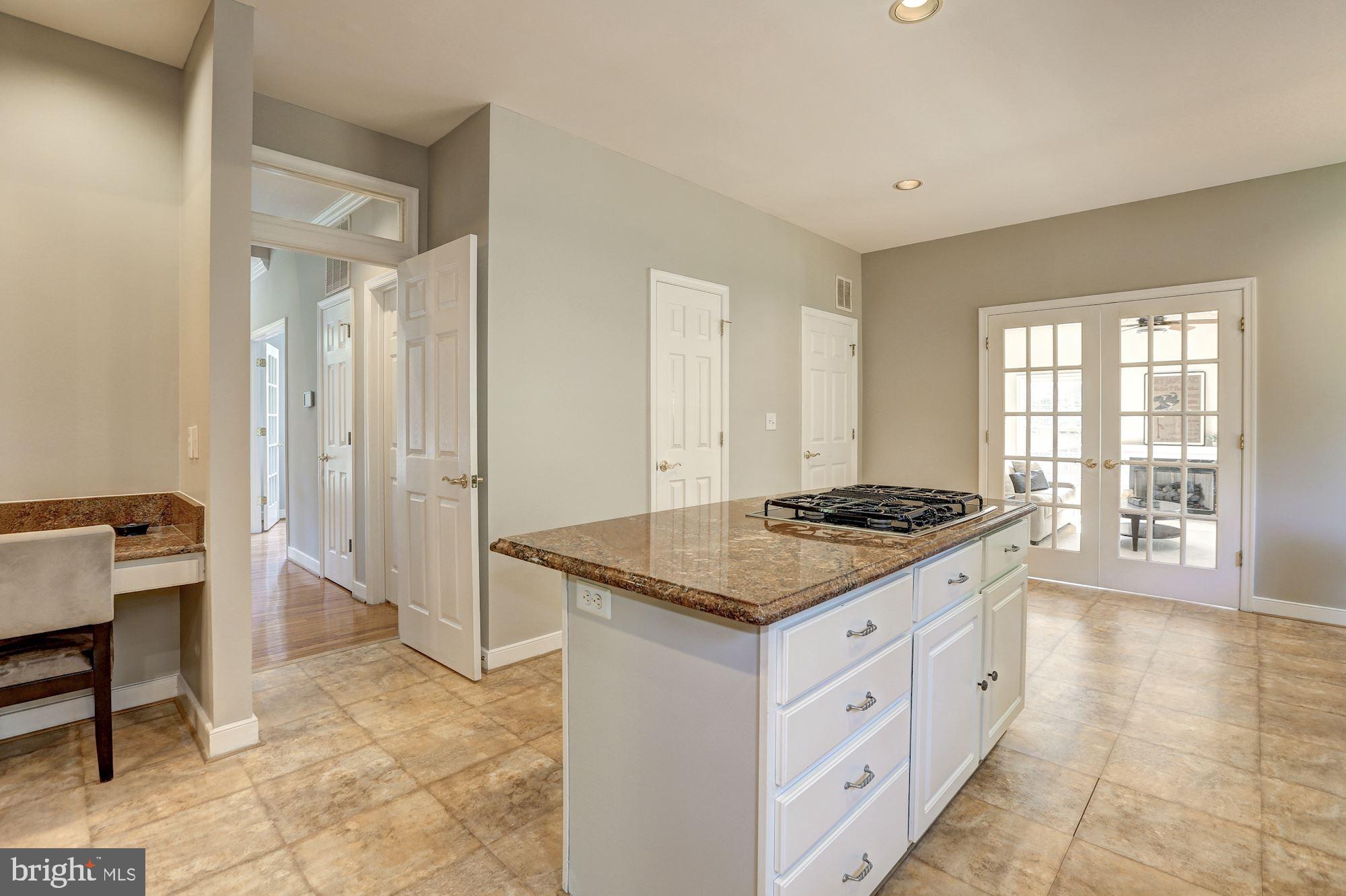 10234 Parkman Road Silver Spring, MD 20903 - Photo 14 of 33 Kitchen with pantry door and laundry room door