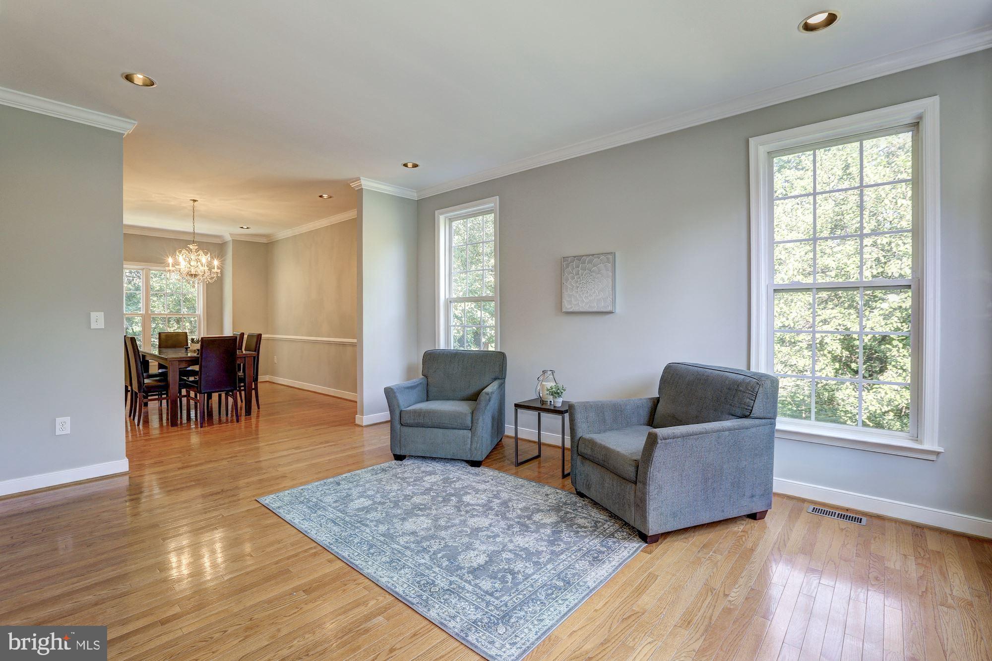 10234 Parkman Road Silver Spring, MD 20903 - Photo 6 of 33 Living room flows to dining room