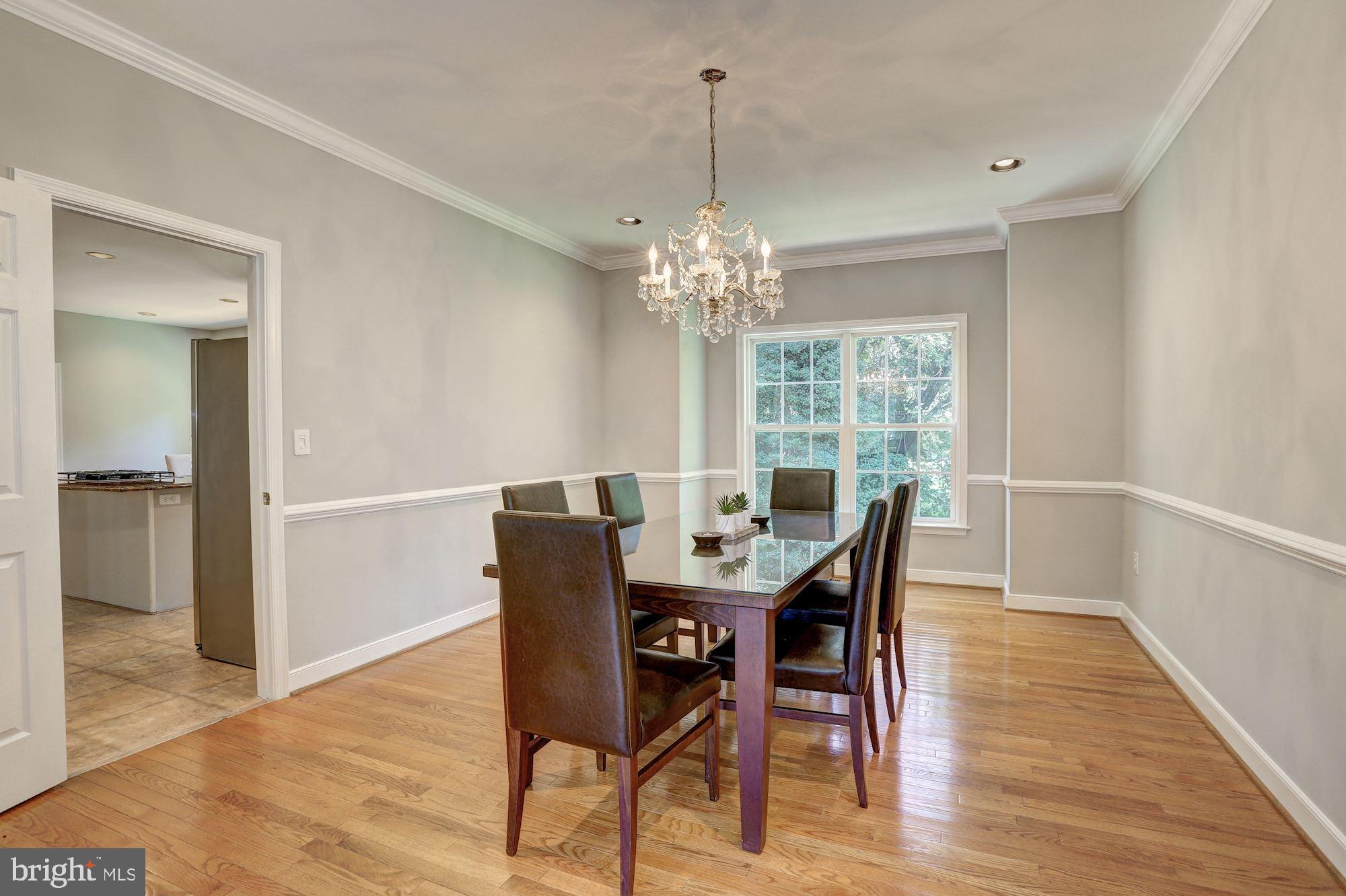 10234 Parkman Road Silver Spring, MD 20903 - Photo 8 of 33 Dining room features chair rail & crown molding
