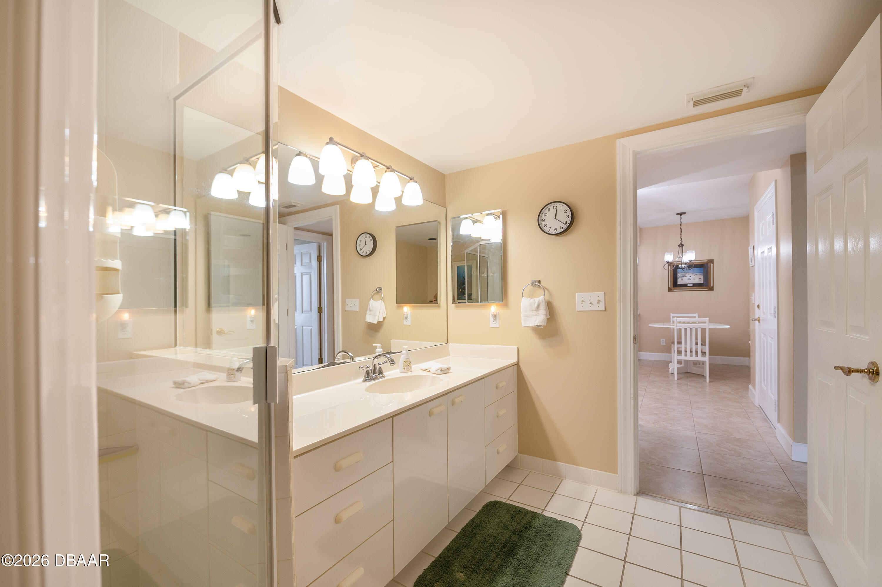 4575 South Atlantic Avenue, Unit 6701 Ponce Inlet, FL 32127 - Photo 29 of 35 a bathroom with a double vanity sink mirror and bathtub