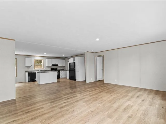 a view of kitchen with sink and cabinets