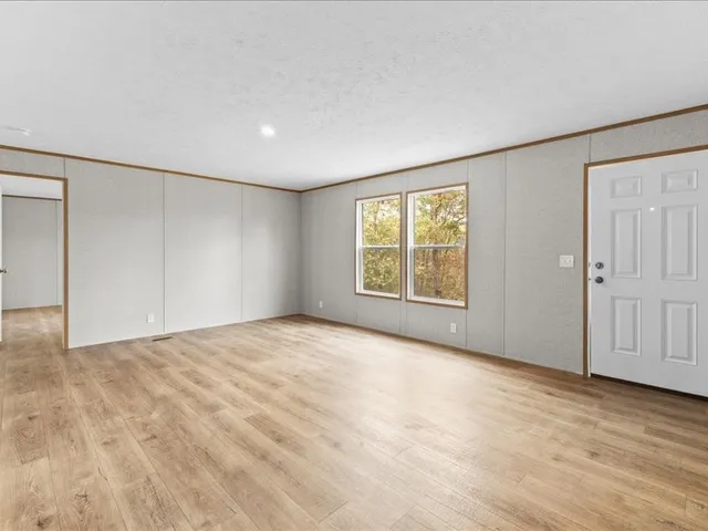 an empty room with windows