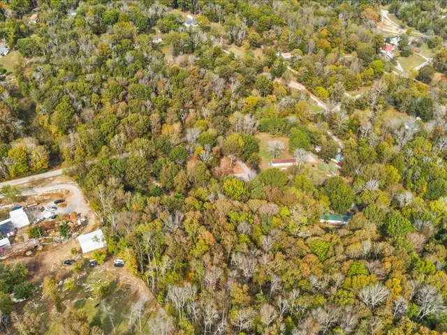 a view of a hallway with wooden floor and entryway
