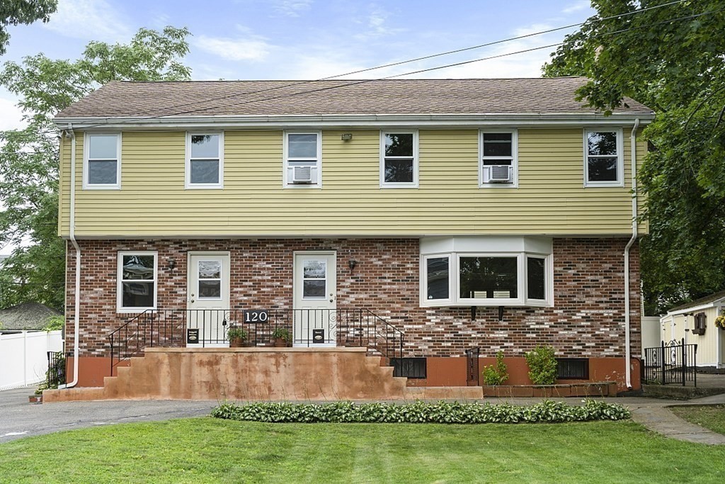 front view of a house with a yard