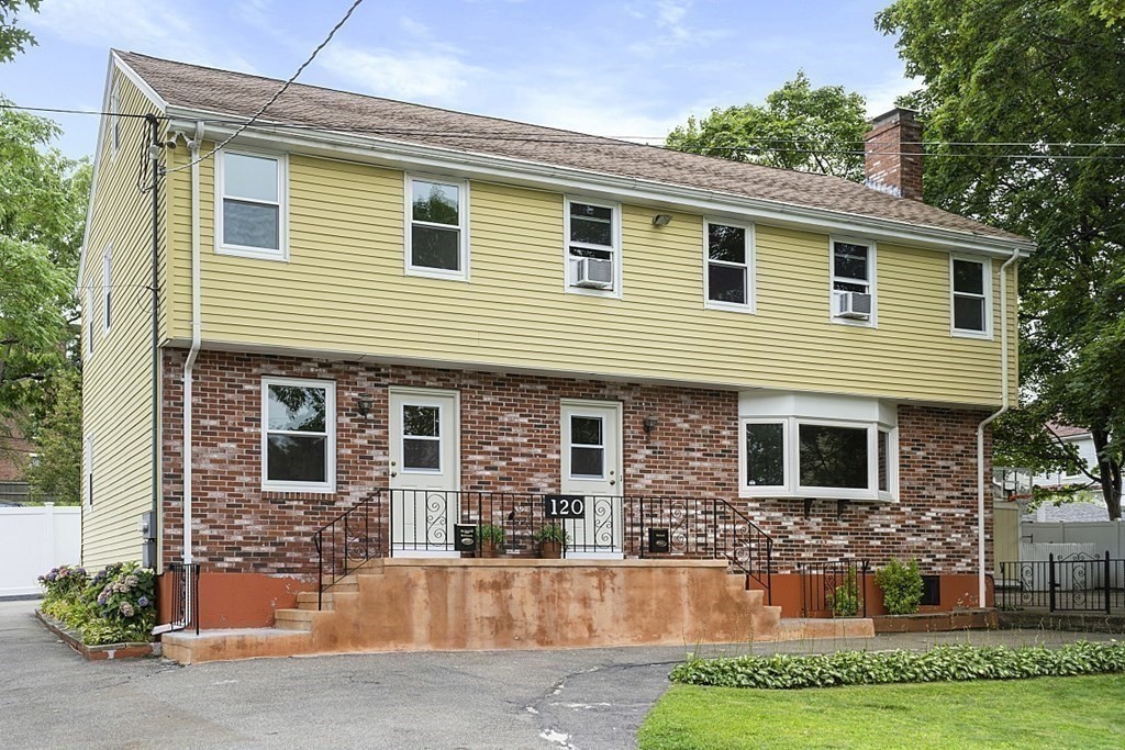 120 Birch Street Boston, MA 02131 - Photo 16 of 42 a front view of a house with a yard