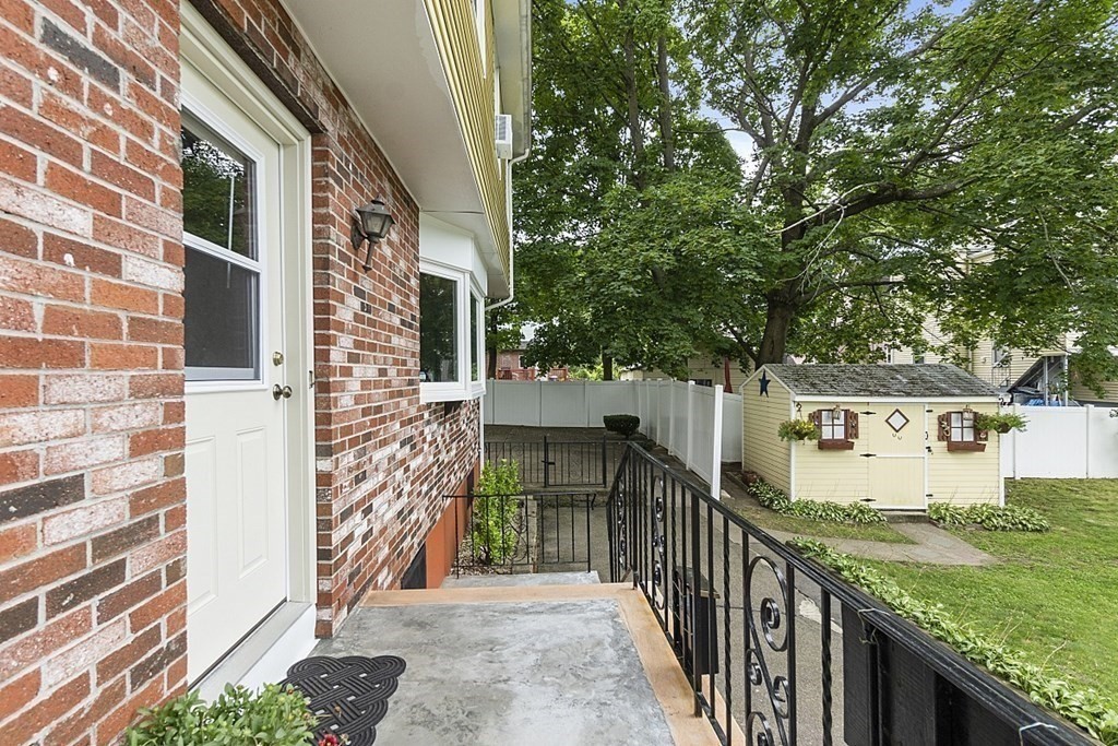 120 Birch Street Boston, MA 02131 - Photo 2 of 42 a view of a pathway both side of building