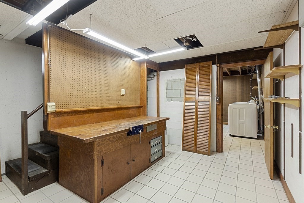 120 Birch Street Boston, MA 02131 - Photo 29 of 42 a kitchen with a refrigerator and countertop