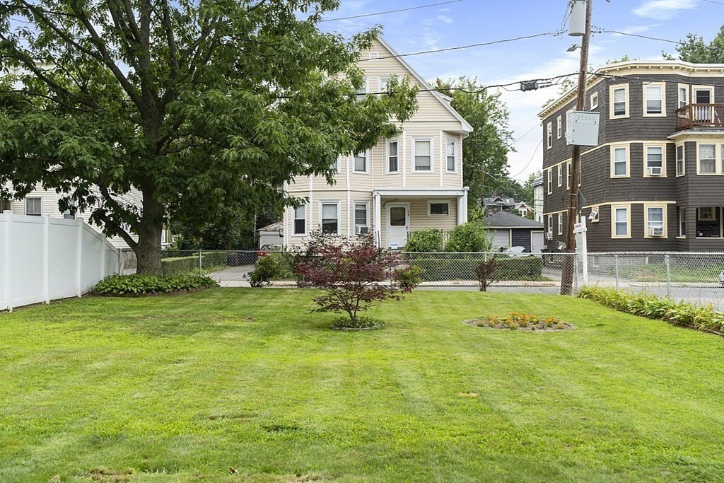 120 Birch Street Boston, MA 02131 - Photo 3 of 42 a swimming pool with outdoor seating and yard