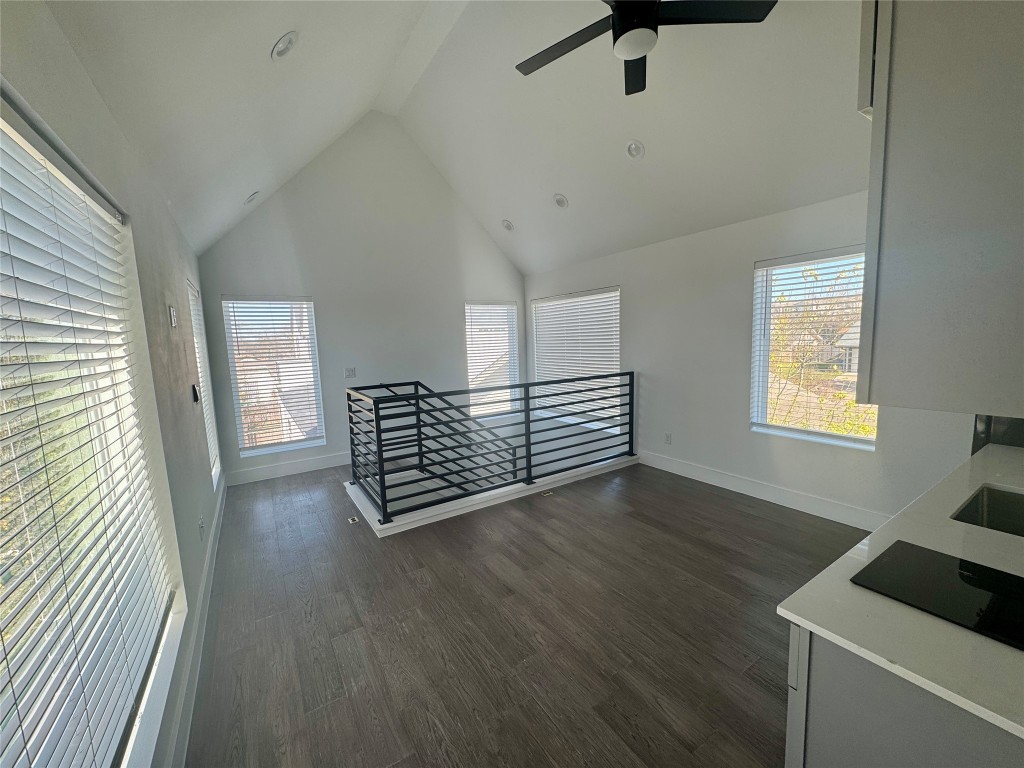 1916 Webberville Road, Unit C Austin, TX 78721 - Photo 4 of 10 a view of an empty room with a window and wooden floor