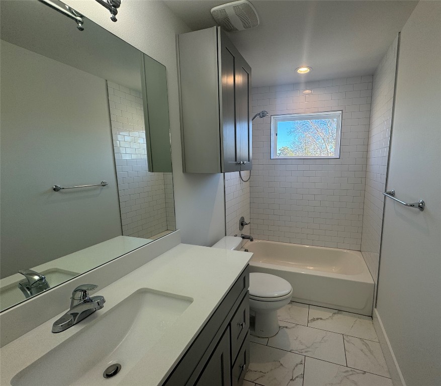 1916 Webberville Road, Unit C Austin, TX 78721 - Photo 6 of 10 a bathroom with a sink a toilet and shower