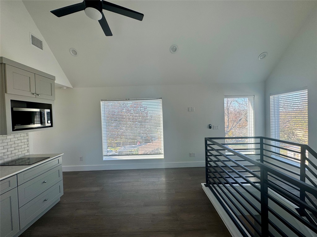 1916 Webberville Road, Unit C Austin, TX 78721 - Photo 8 of 10 a view of entryway and hall with wooden floor